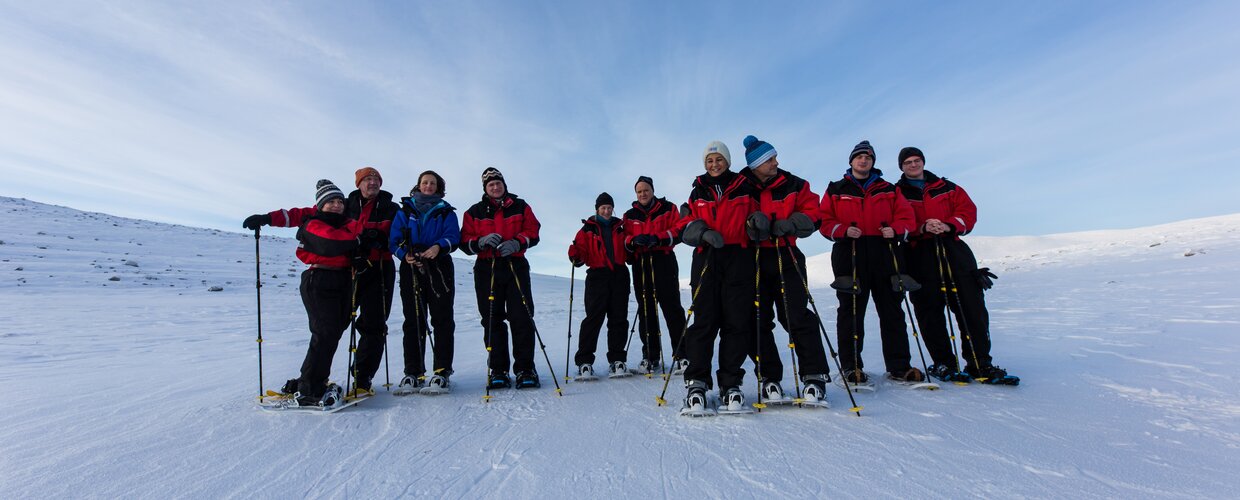 A group out on a guided snowshoeing tour